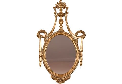 A sensational Italian Neoclassical 19th century style giltwood oval mirror, carved and gilded with French gold foils and patinated, The mirror plate within a moulded beaded ribboned frame terminating with leafy works and surmounted with a baluster shaped torch with flame with S shape scrolled leaves extended with long turned acanthus leaves connected with exquisite drapery pendants